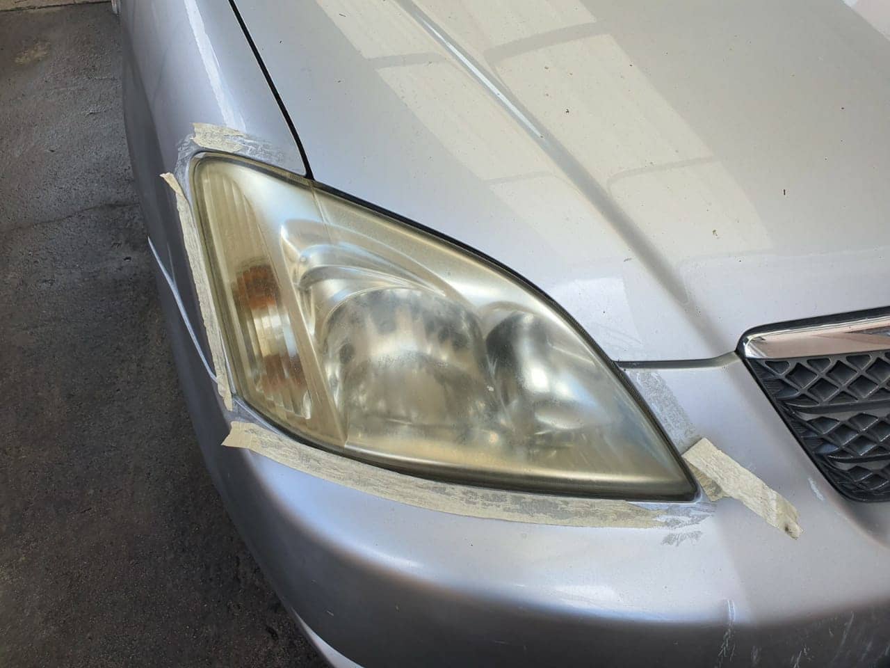 Photo of Toyota Corolla RUNX Headlight Restoration Before