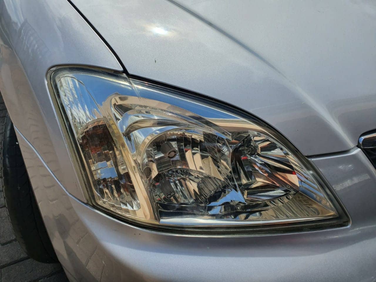 Photo of Toyota Corolla RUNX Headlight Restoration After