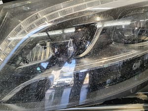 Mercedes S-Class right hand side headlight needing restoration from deep chips and pitting